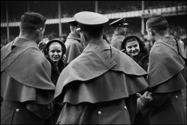 NEW YORK CITY—West Point cadets and their admiring young ladies attend the Army vs. Notre-Dame football game, 1947. © Henri Cartier-Bresson / Magnum Photos