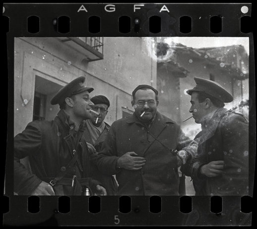 TERUEL, Spain—Ernest Hemingway (third from left), New York Times journalist Herbert Matthews (second from left), and two Republican soldiers, late December 1937. © ROBERT CAPA © 2001 By Cornell Capa / Magnum Photos