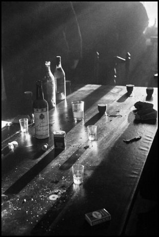 SPAIN—Bottles and glasses on a table in the Basque region, January 1937. © David Seymour / Magnum Photos